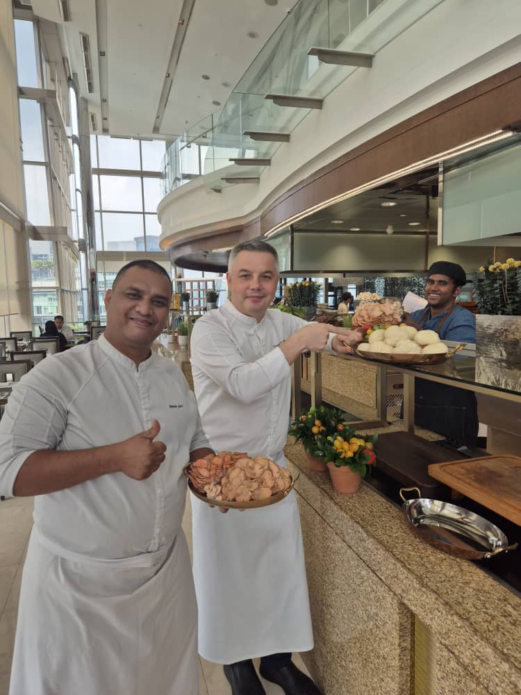 Grand Hyatt KL chefs presenting trays of freshly harvested Shroomy mushrooms