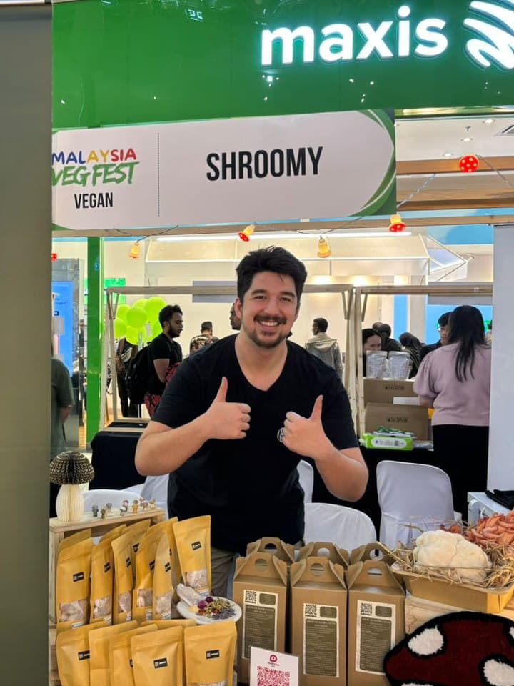 The Shroomy booth at Malaysia VegFest, stacked with grow kits and dried mushroom packs